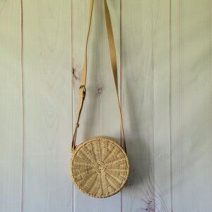 Round Woven Ratton Crossbody Bag. Tan/Cream color with zipper closure.  Boho